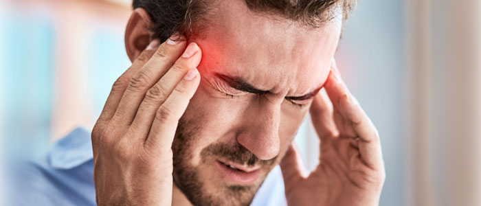 a photo of a guy with a headache